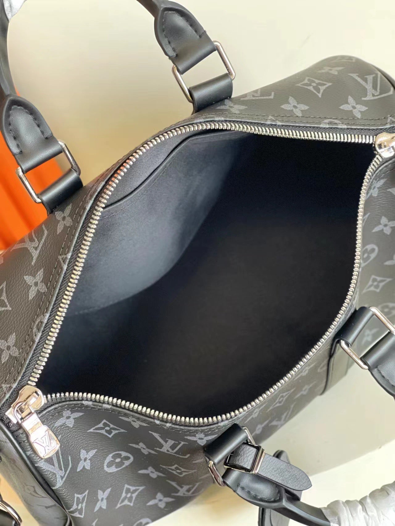 L classic embossed black hand-held cross-body bag 0725012104