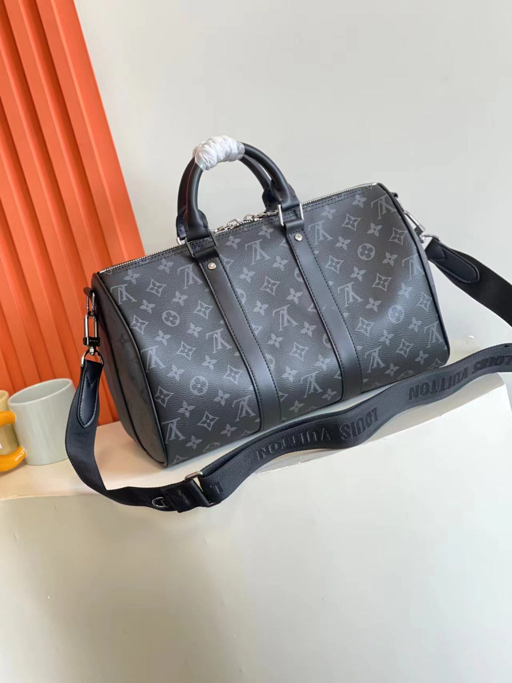 L classic embossed black hand-held cross-body bag 0725012104