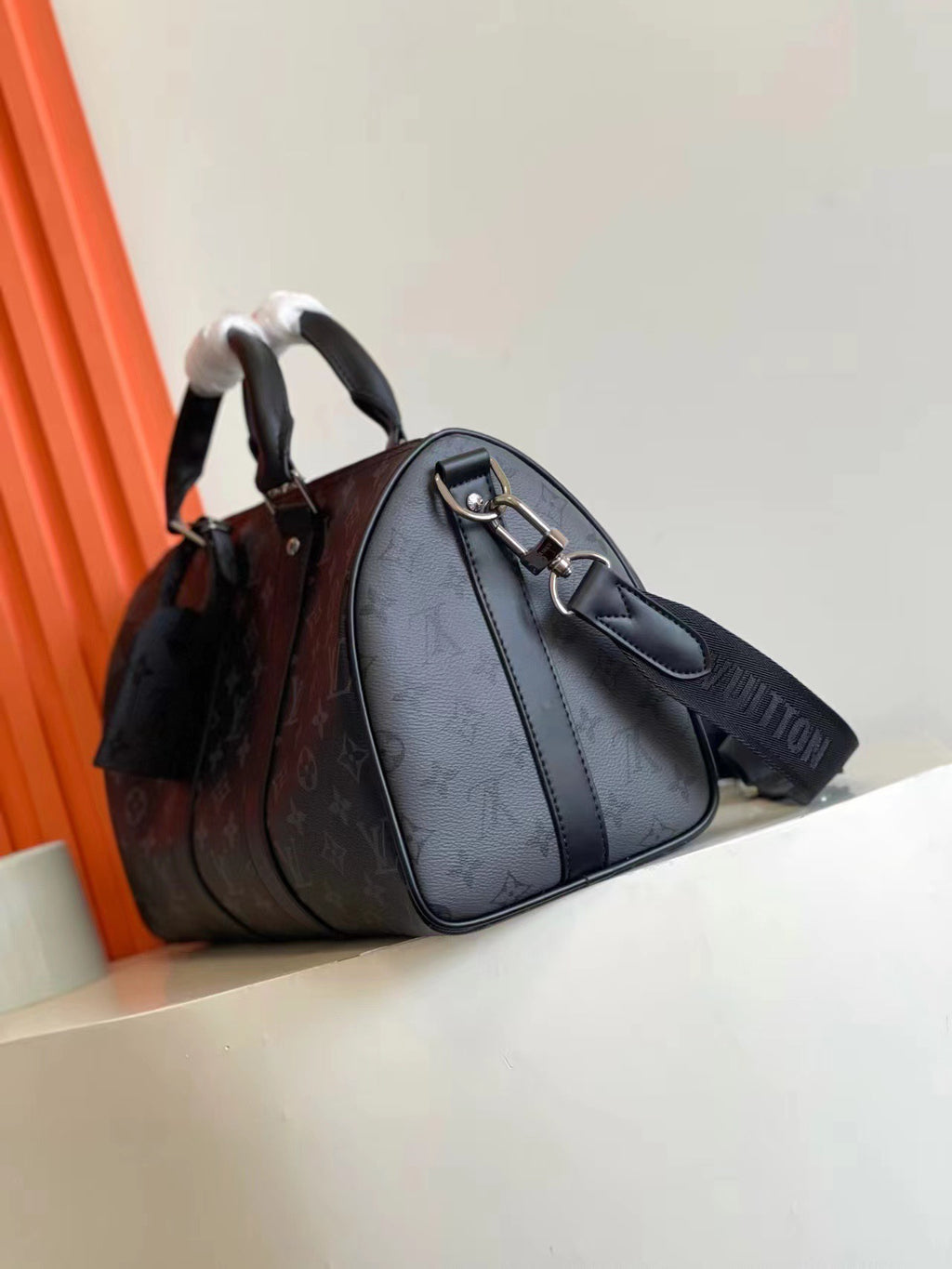 L classic embossed black hand-held cross-body bag 0725012104